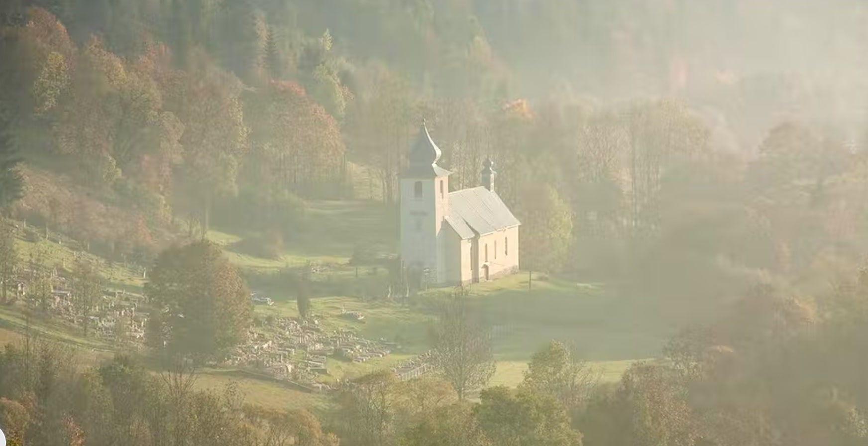 church and cemetery on misty morn