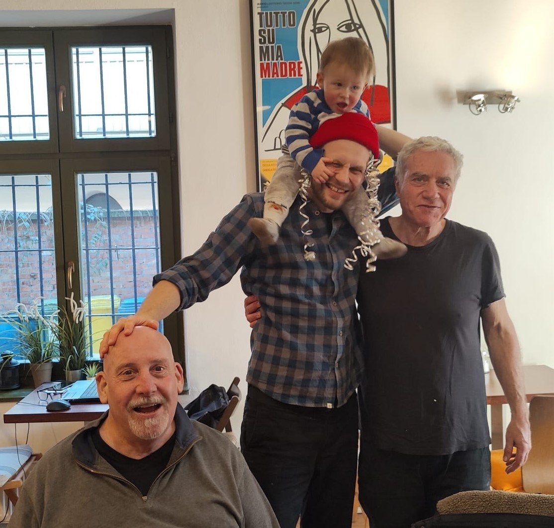 <image: me, Leon, Michał, and Nava at Bagelmama's>